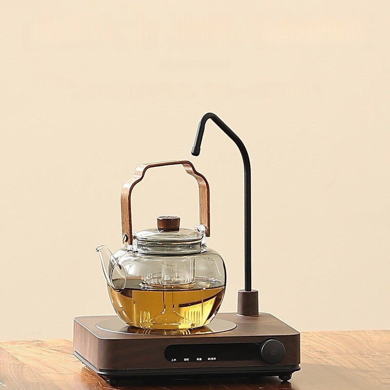 An Automatic Water Filling Electric Tea Stove and Tea Pot Set