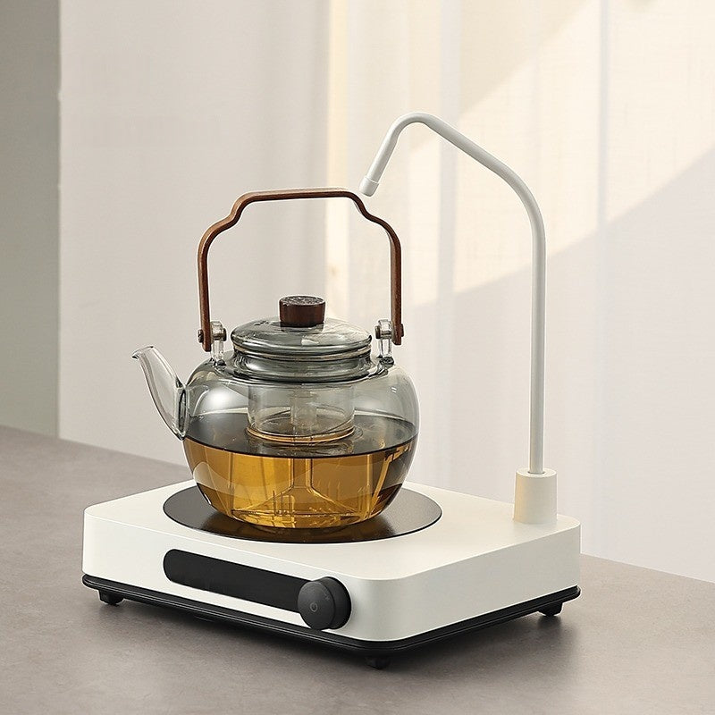 An Automatic Water Filling Electric Tea Stove and Tea Pot Set