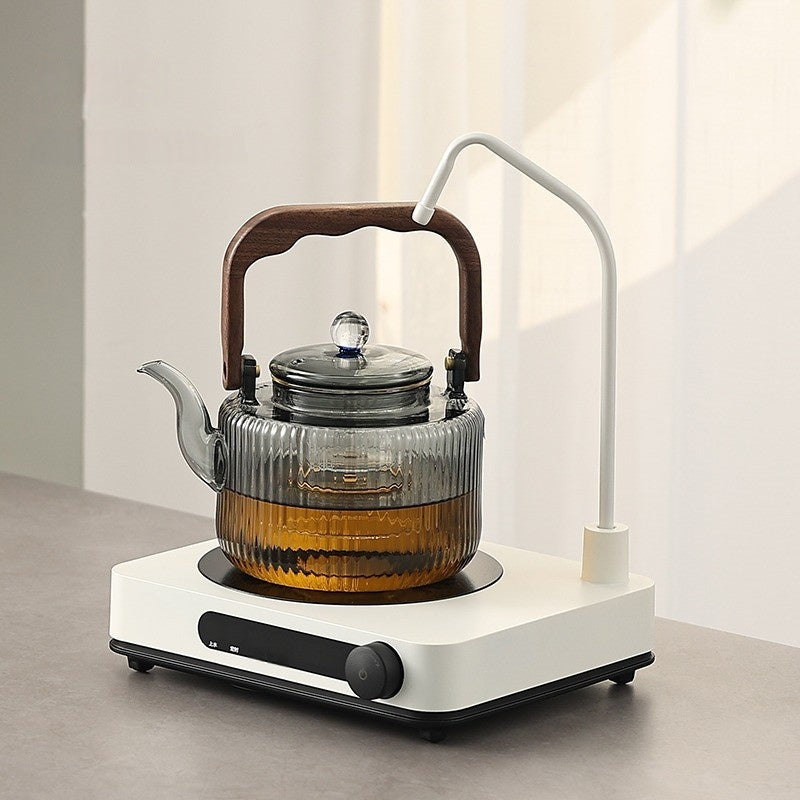 An Automatic Water Filling Electric Tea Stove and Tea Pot Set