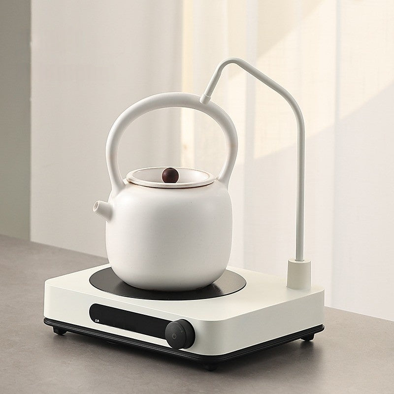 An Automatic Water Filling Electric Tea Stove and Tea Pot Set