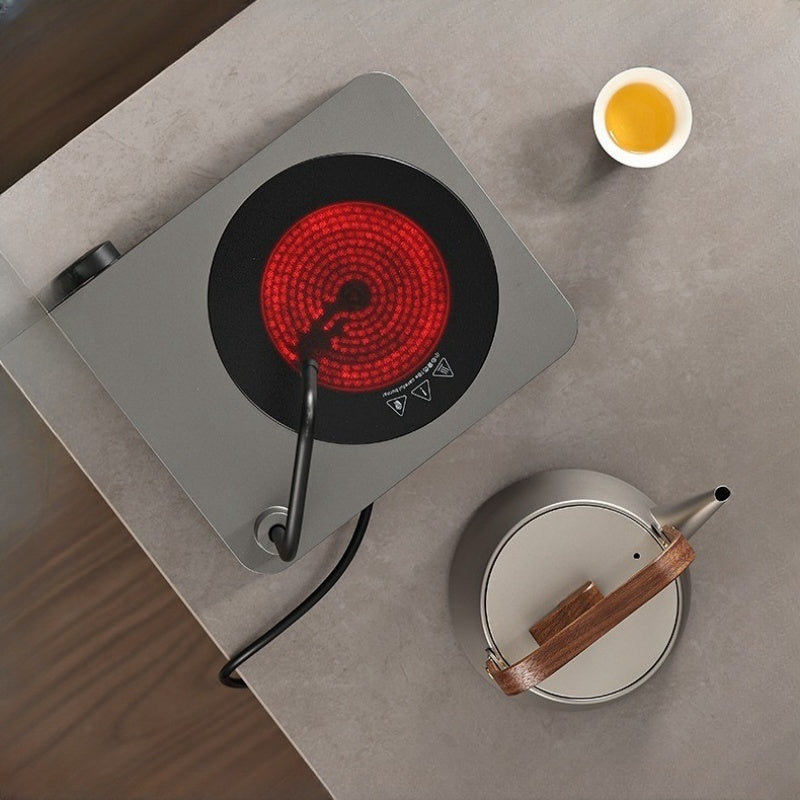 An Automatic Water Filling Electric Tea Stove and Tea Pot Set